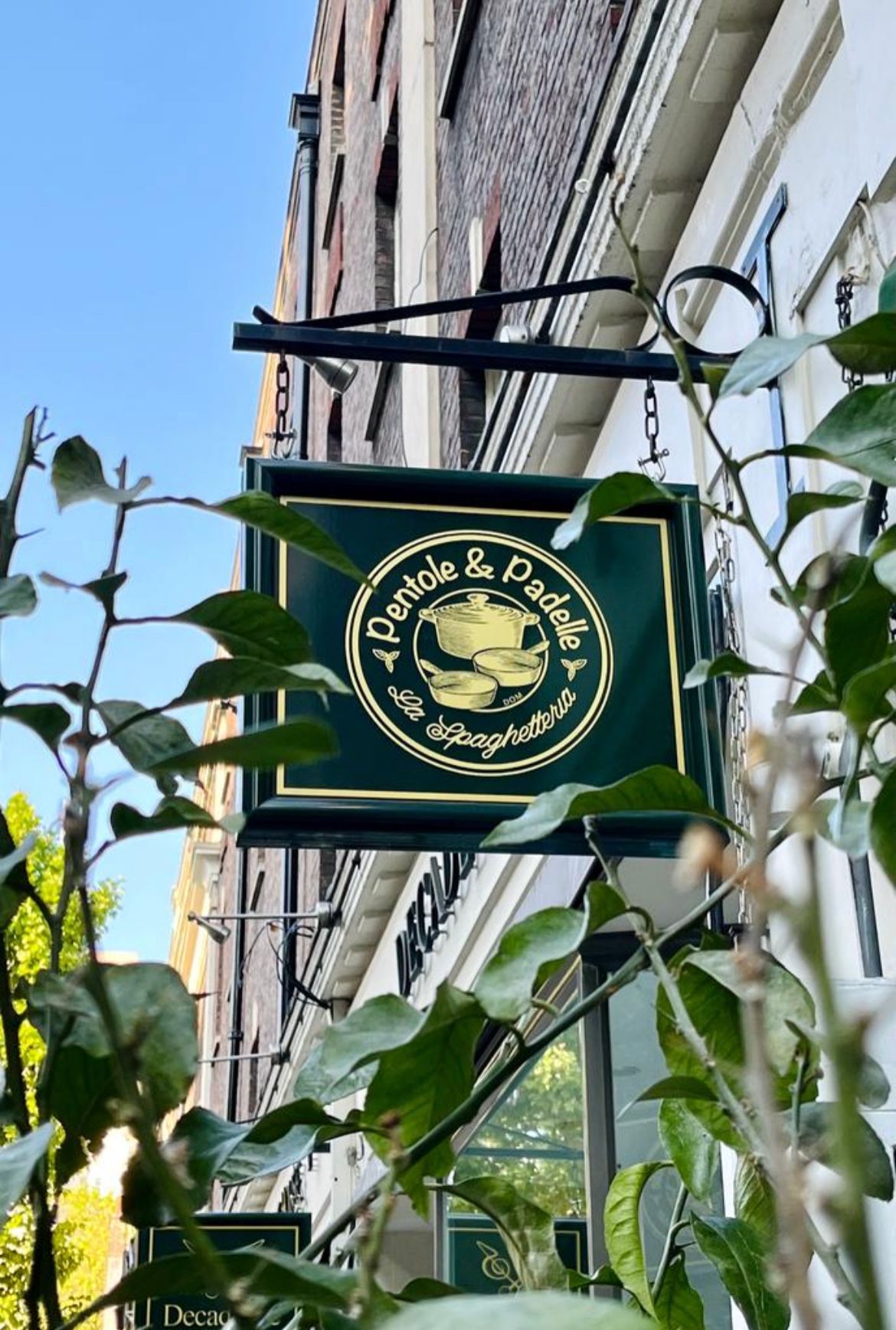 The Pentole & Padelle hanging sign outside the restaurant on Store Street, Bloomsbury